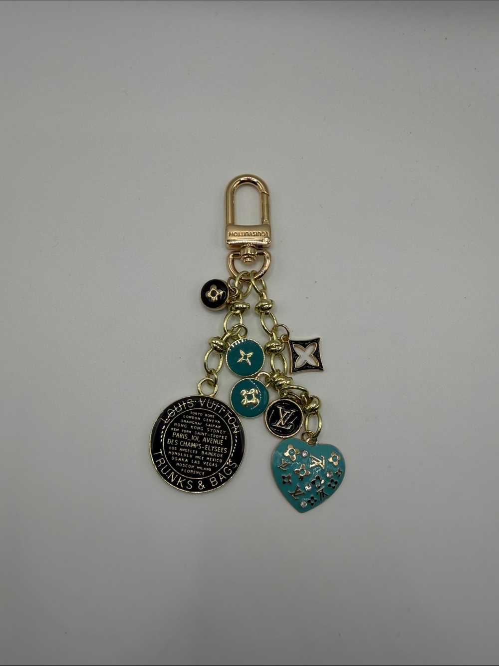 1417. Turquoise and Gold Logo Charm Key Holder